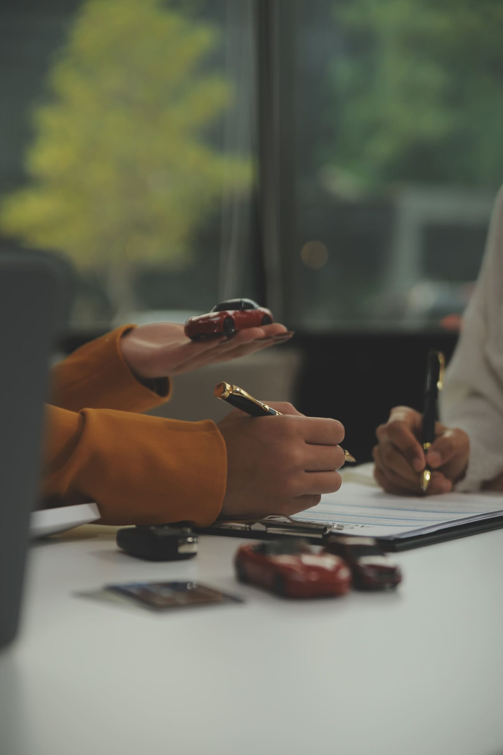 insurance-officers-hand-car-keys-after-tenant-have-signed-auto